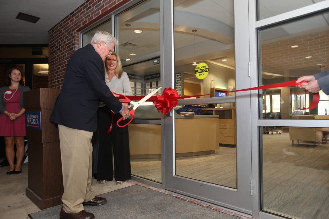 David F. Miller cuts the ribbon for the Retail Center