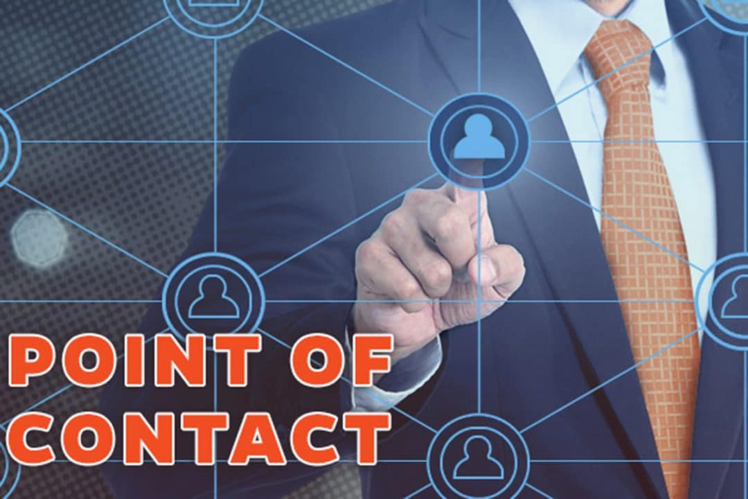 Chest height of man in business suit touching his finger on a point connected with lines to multiple circles