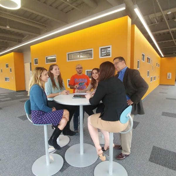 Students around a table in the Collaboratory-Square