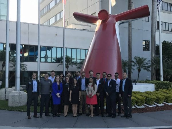 UF MBA students pose in front of the Carnival Cruise offices