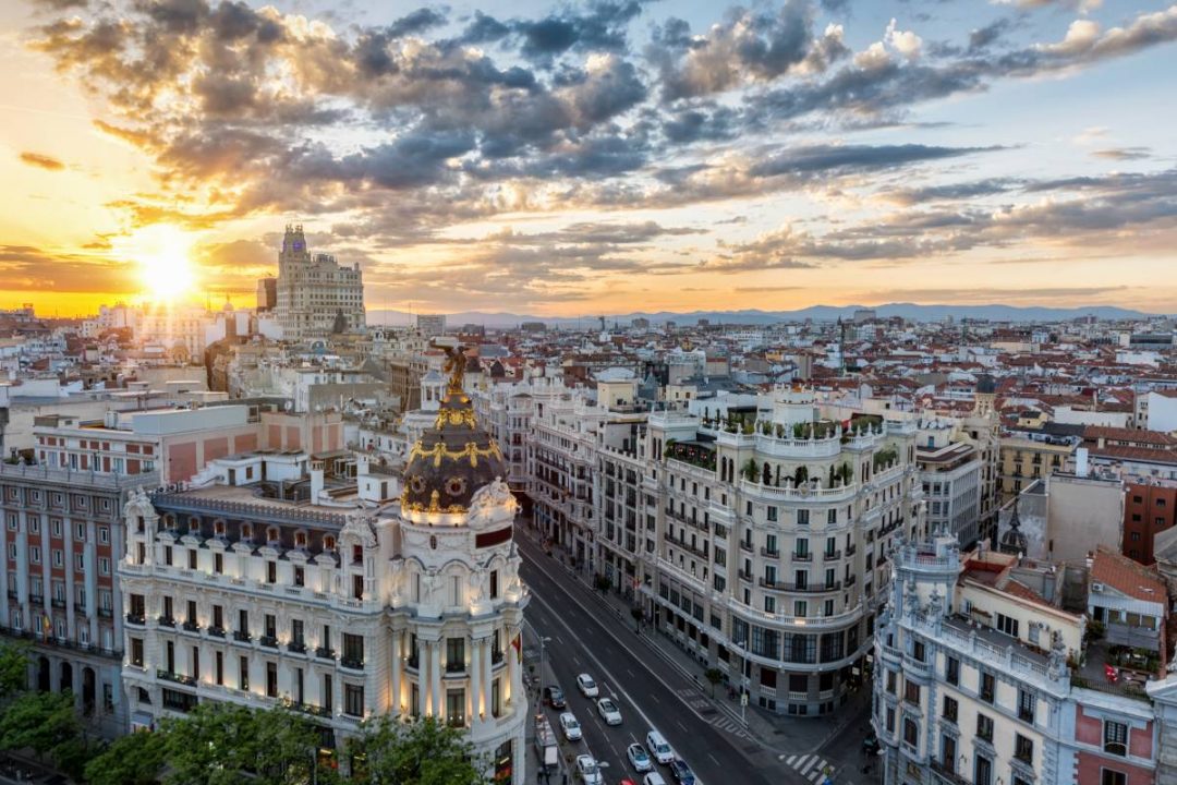 Madrid skyline with the sun setting in the background