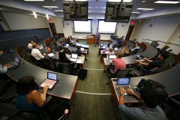 UF MBA students listening in class to Professor Anthony Coman.