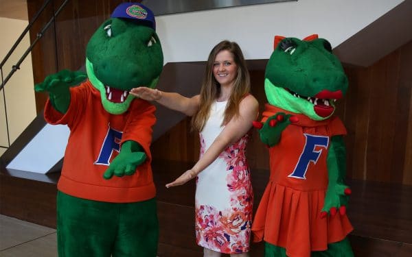 MSM student Ashley Owens with Albert and Alberta doing the Gator Chomp.