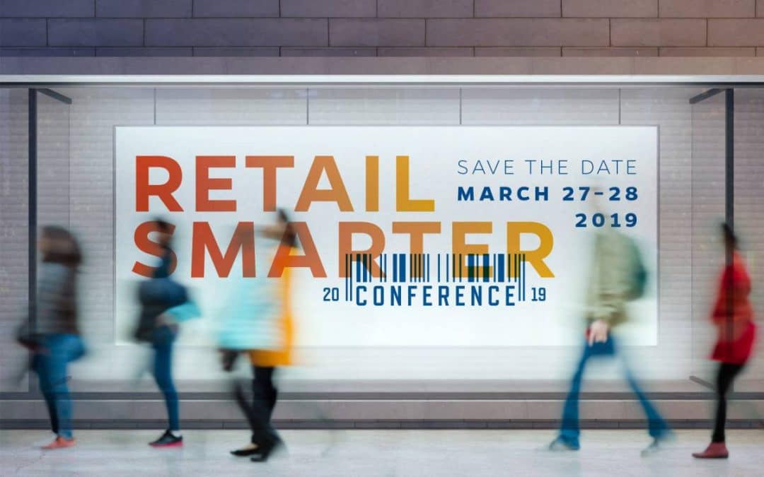 Sign in subway station that says Retail Smarter Conference Save the Date March 28-29, 2019 with blurs of people walking by.