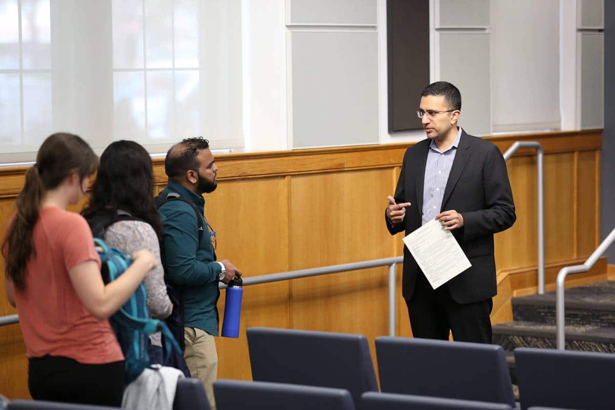 Charles Carmakal speaks to students in Dr. Praveen Pathak's class about the current cybersecurity landscape in February 2019.