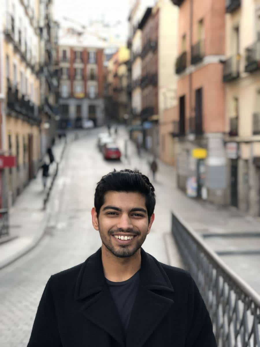 Rahul Kheraj stands in the street on his first day in Madrid, Spain