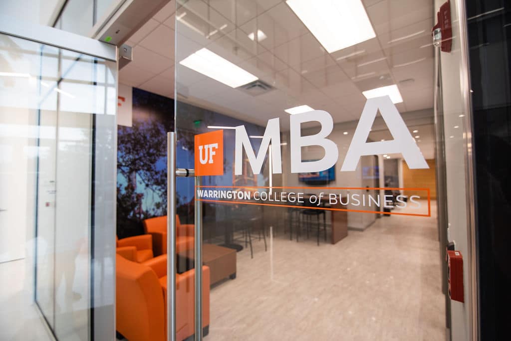 Glass door with UF MBA logo leading to the entrance of the new UF MBA South Florida location in Miramar
