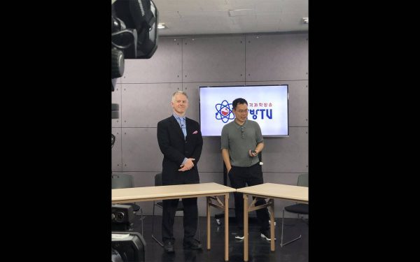 David Ross stands with AfreecaTV founder and CEO Kevin Seo on Kevin's live broadcast focused on science