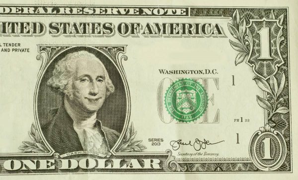 Happy President George Washington smiles on dollar bill