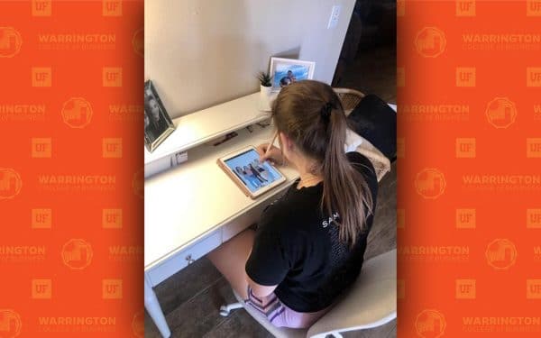 Heavener School student Cheyenne Keating sitting at a desk drawing on an iPad