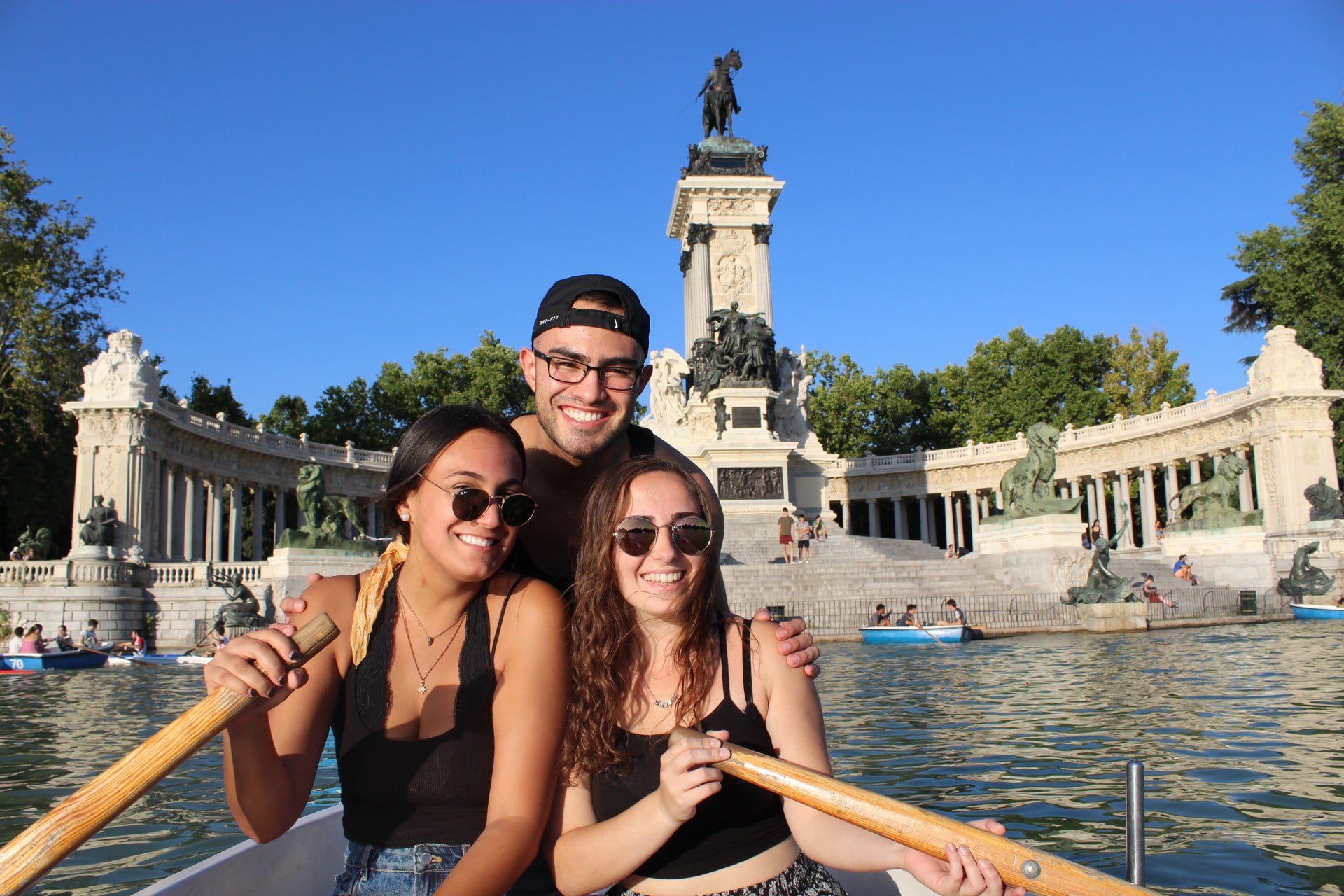 Iara Dircie with two other UF students canoeing in a lake in Madrid
