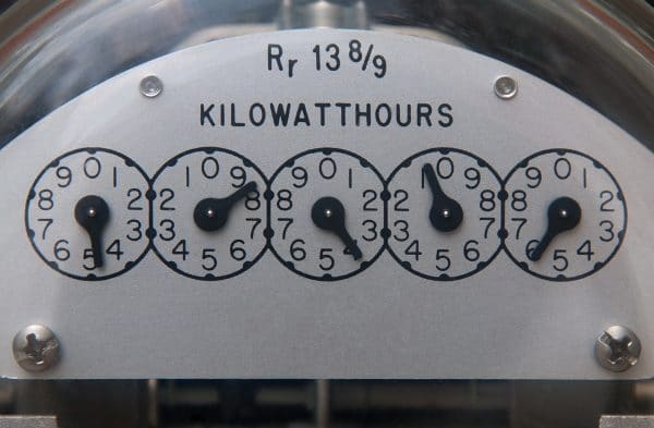 Close up image of an electric meter displaying the kilowatts per hour measurement.