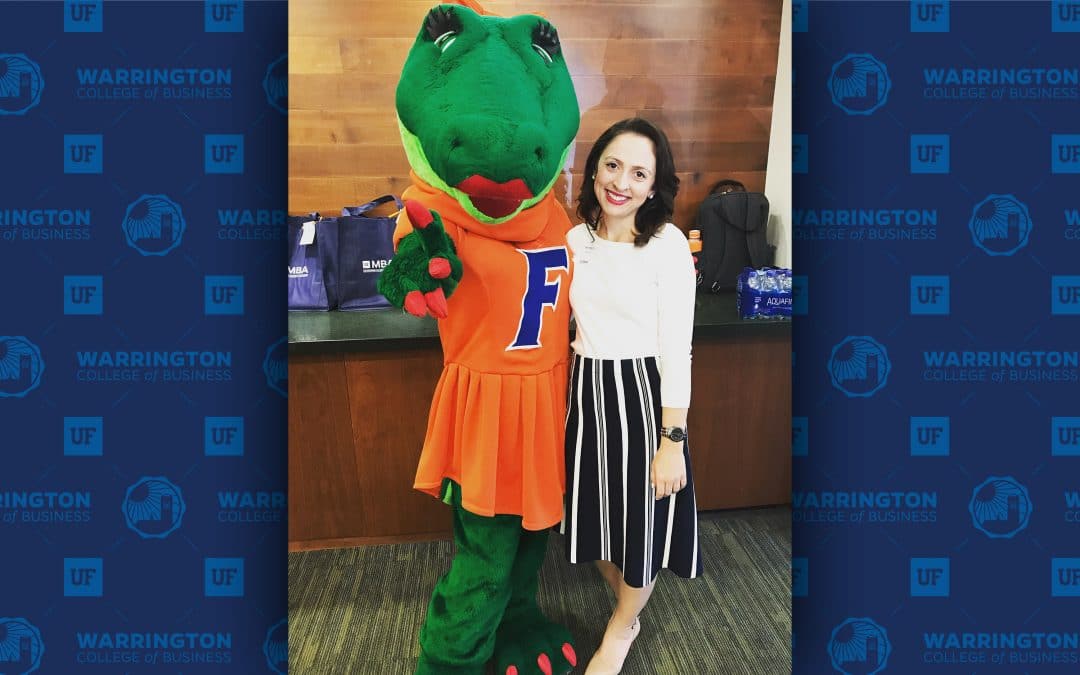Full-Time MBA student Kristyn Cadwell and Alberta the Alligator pose for a photo at a UF MBA event.