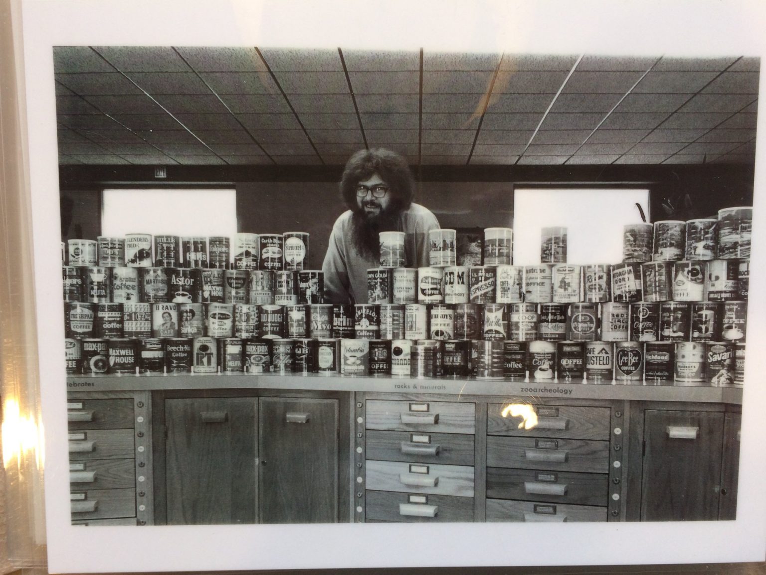 Thomas Olmstead with his coffee can collection