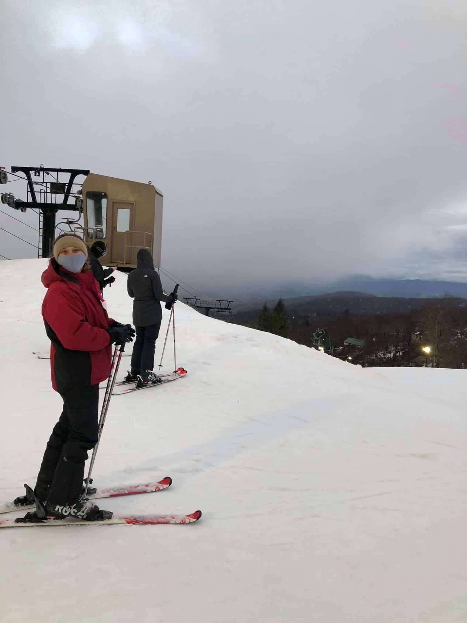 Ashley Arndt poses for a photo on skis before heading down the slope.