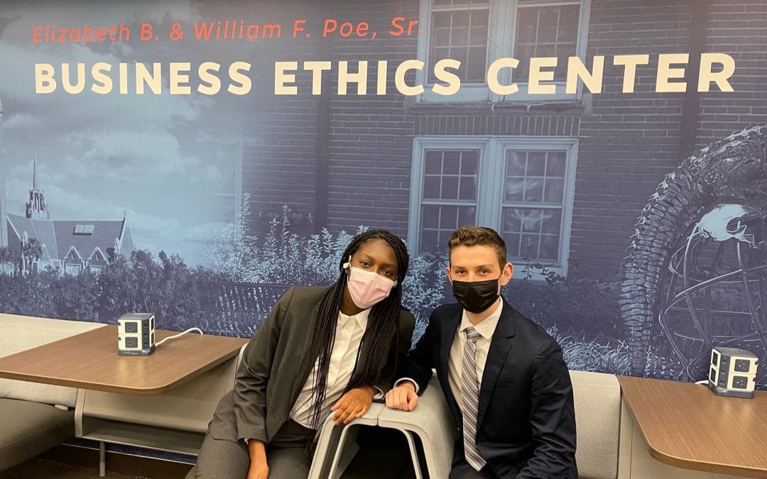 Kitan Adeniji and Zach Kashman pose for a photo in the Poe Business Ethics Center
