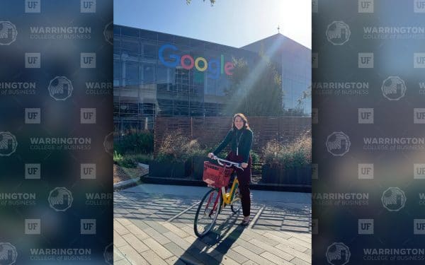Nelly Wilson poses for a photo on a bike in front of Google's office in Austin.
