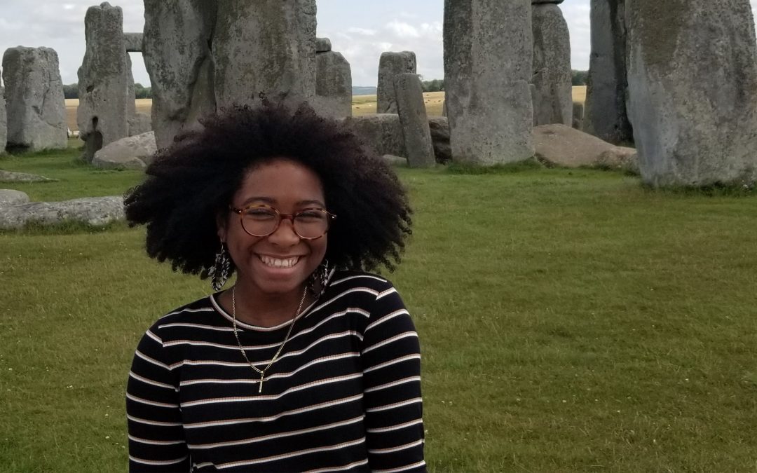 Makayla Nicholas poses for a photo in front of Stonehenge in England.