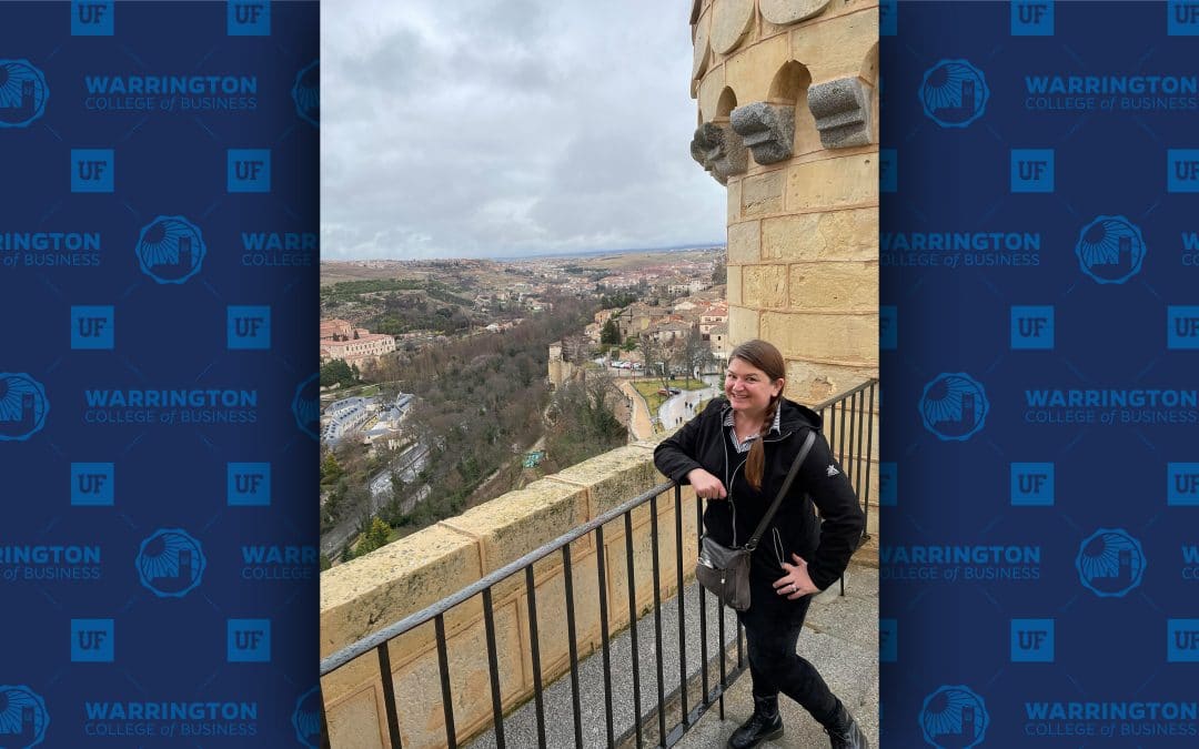 Tara Nobles stands on a balcony overlooking the city of Segovia, Spain.