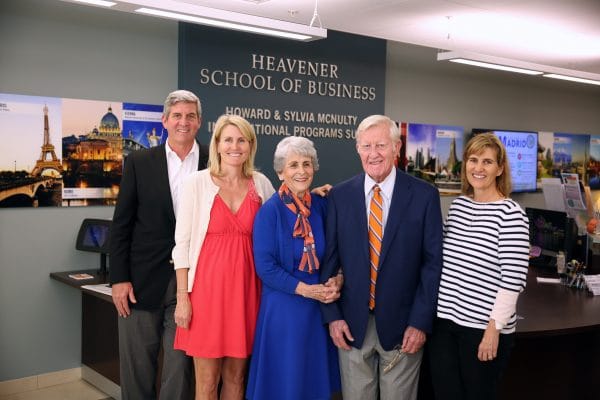The McNulty Family poses for a photo in the Heavener School of Business.
