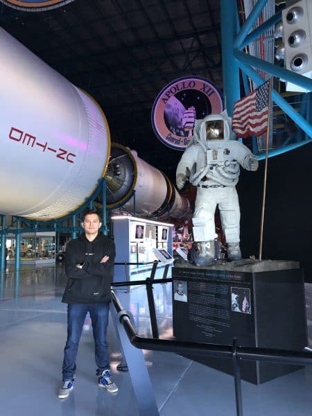 Almas Khamza at Kennedy Space Center with a space suit.