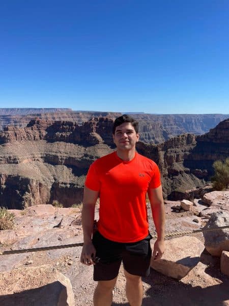 Gabriel Marinez poses in front of the Grand Canyon.