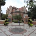 University of Florida archway with Heavener Hall in the background.