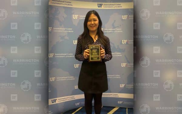 UF MBA and MS-ISOM student Hae Jin So holds her award from the UF International Center International Student Awards.