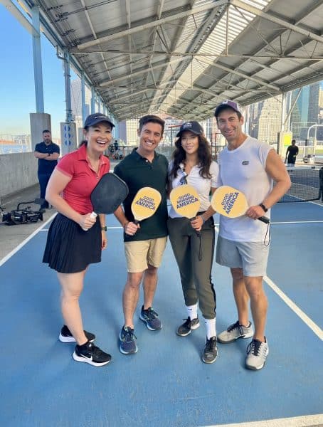 Brian Levine and his teammates pose at a Pickleball match.