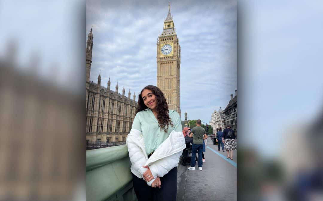 Sophia Castellanos poses in front of Big Ben clocktower.