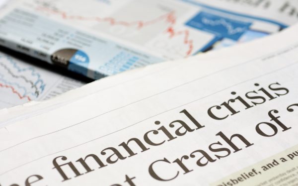 Close up of newspaper headline for financial crisis news