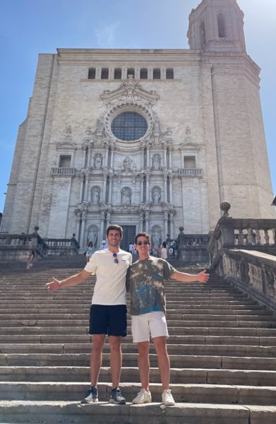 Harrison Haber and friend pose in front of a building in Spain