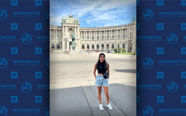 Grishma Patel poses in front of a historic building.
