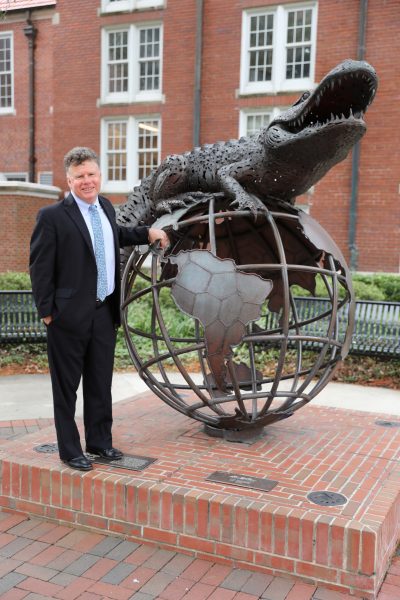 Joel Houston with Gator Globe statue.
