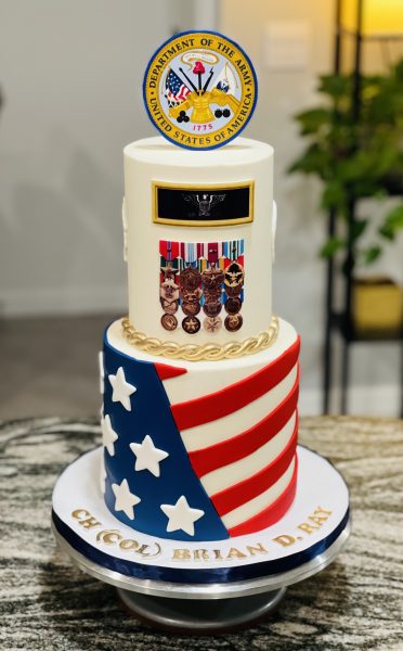 Military retirement cake decorated with flag and medals.