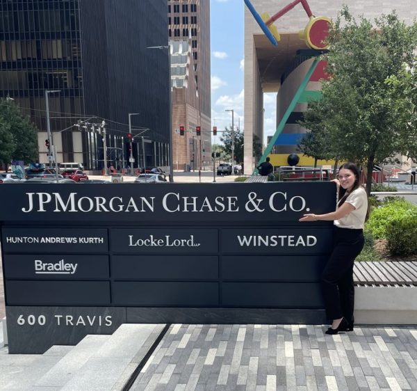 Ana Herrera poses next to JPMorgan Chase sign.
