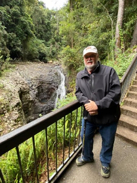 Robert Knechel overlooking a waterfall.
