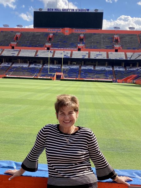 Ana Noy poses in front of the Ben Hill Griffin football stadium.