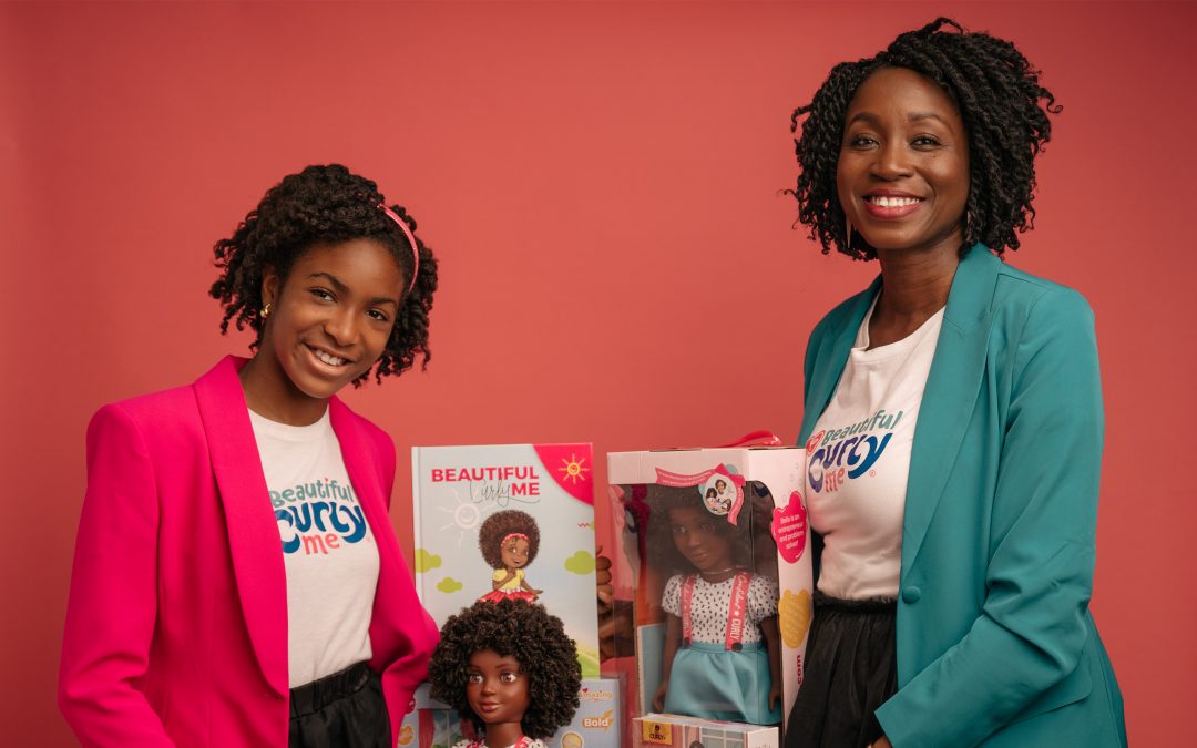 Evana and Zoe Oli pose with products from their business.