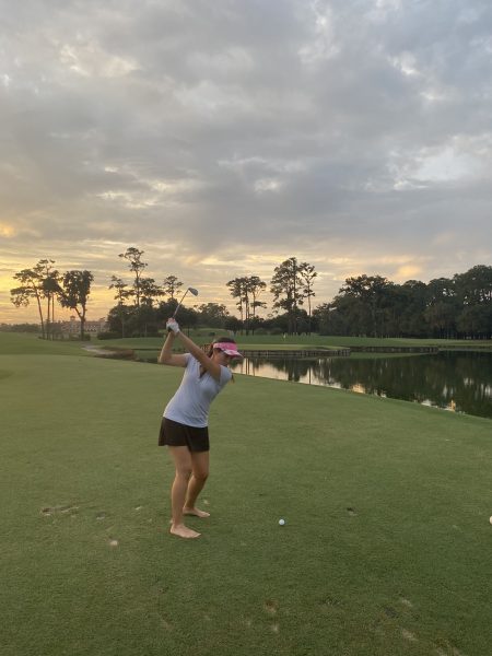 Stephanie Royer playing golf.