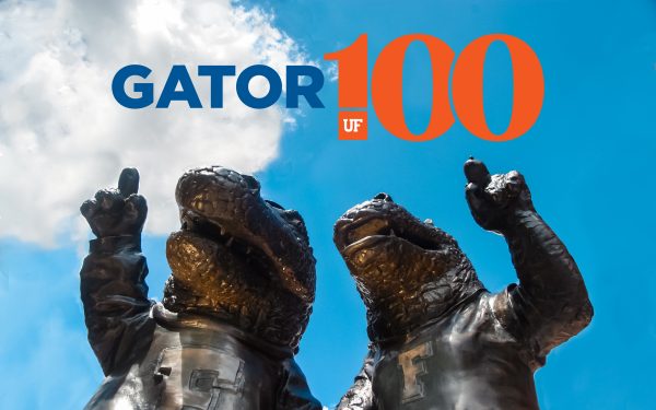 Gator100 logo above a bronze statue of UF mascots Albert and Alberta.