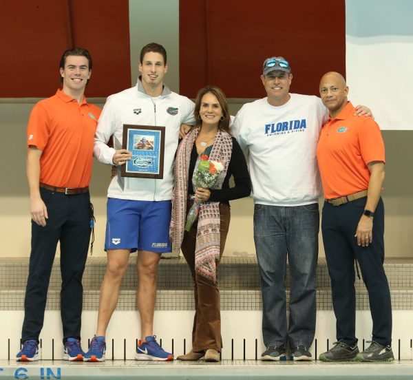 Florida Swimming Assistant Coach Jack Szaranek, Alberto Mestre, Alberto Mestre's mother and father and Florida Swimming Head Coach Anthony Nesty.
