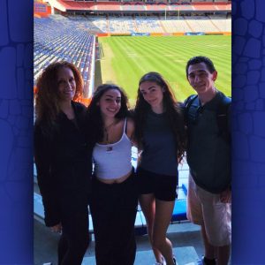 Prida family poses in the Ben Hill Griffin Football Stadium.