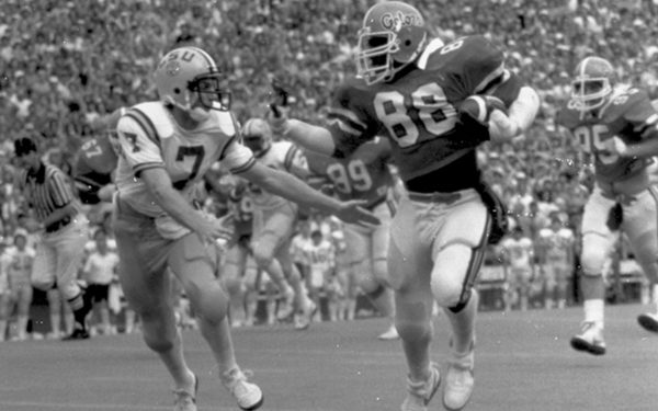 Two football players in motion on the field.