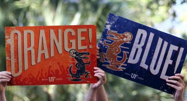 Team signs reading Orange and Blue.