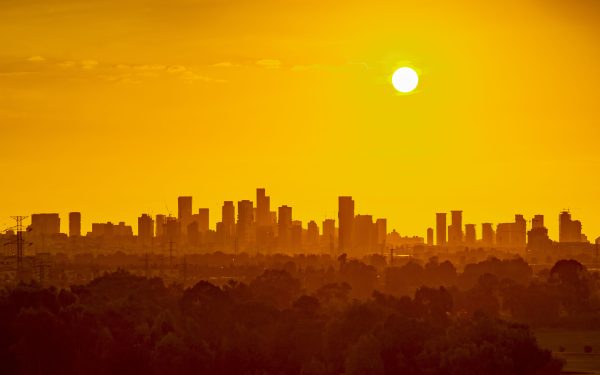 Cityscape with orange hue indicating a heat wave