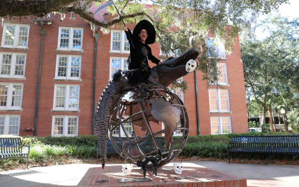 Robert Emerson on GUS the Gator statue.