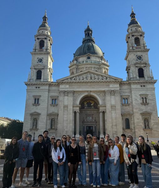 A group of students pose with St. Stephen's Basilica in Budapest, Hungary.