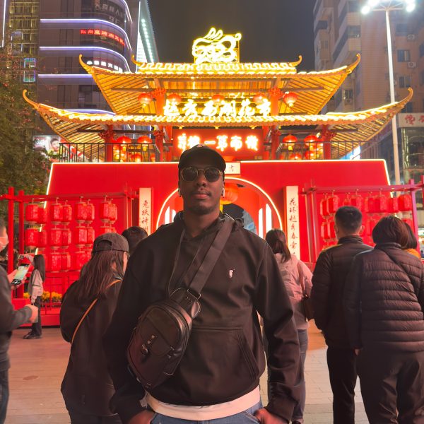 Allan Kuboyo with Chinese architecture.