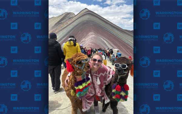 Alyssa Grace Vegter poses with llamas and a mountain vista.